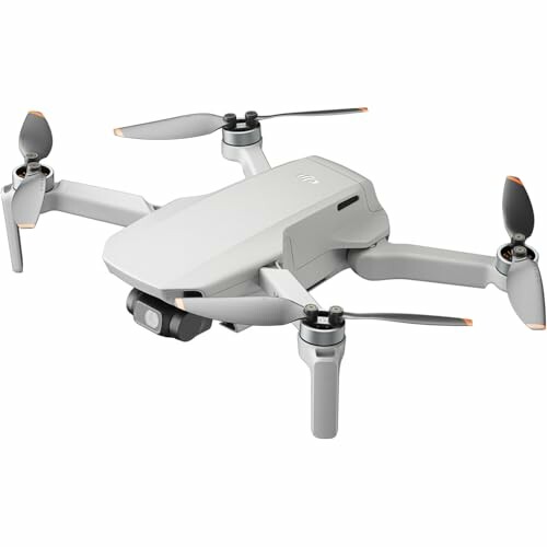 Compact white drone with four propellers.