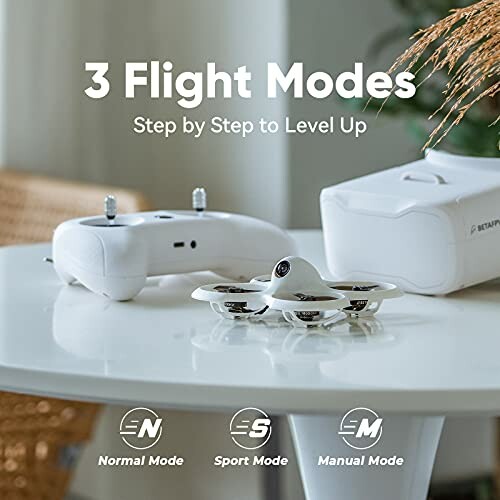 Drone with controller on table, showcasing 3 flight modes.