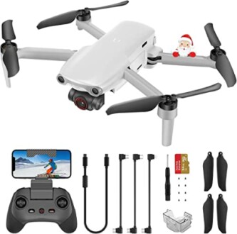 Quadcopter drone with camera, controller, cables, and spare parts.