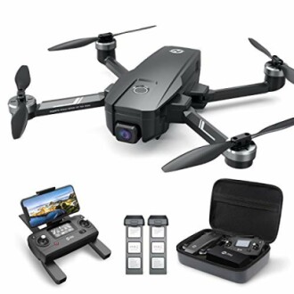 Foldable camera drone with remote, batteries, and carrying case.