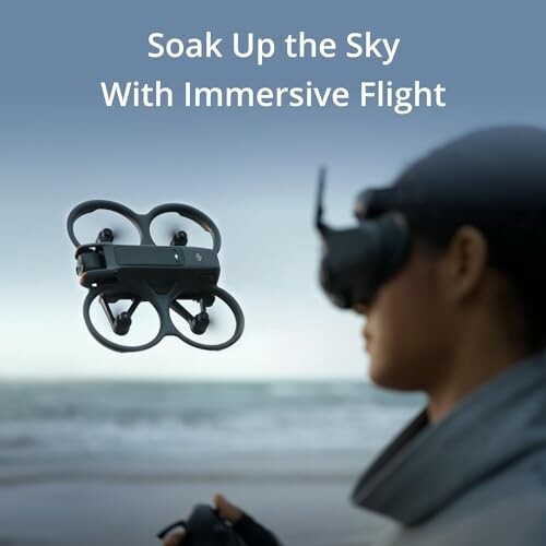 Person using a drone with VR headset by the beach