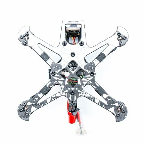 Top view of a quadcopter drone frame with exposed wiring.